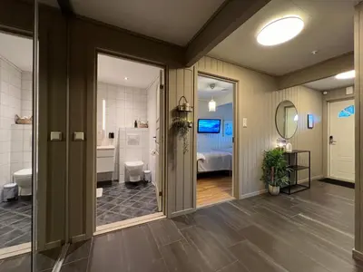 a room with a bathroom and a bedroom at Bratsberg Apartment - with Kitchenette and Free Parking in Trondheim
