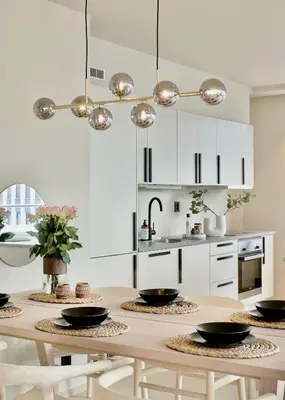a kitchen with a table with black bowls on it at Brand new and luxurious penthouse in Bergen city centre! in Bergen