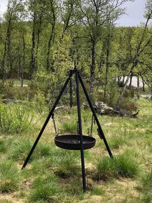 a swing in the middle of a field at Koselig familiehytte på vakre Dagali - nær Geilo in Dagali