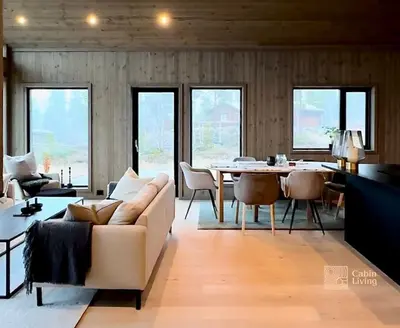 a living room with a couch and a table at Brand new cabin at Hovden cross-country skiing in Hovden
