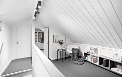 a white room with a table and a chair at 4 Bedroom Nice Home In Rauland in Rauland