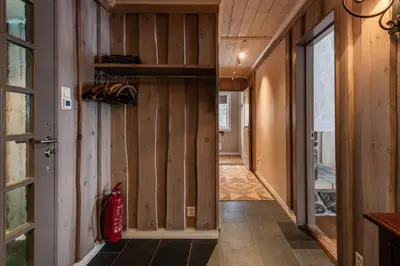 a hallway of a house with wood paneling at Spacious detached house of 209 sqm in the heart of Geilo in Geilo