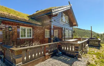 an old wooden house with a grass roof at Beautiful Home In Rjukan With Sauna in Rjukan