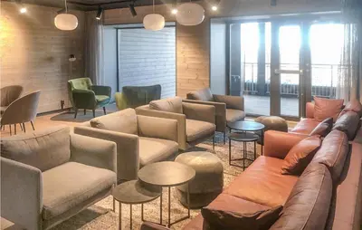 a living room with couches and tables and chairs at Cozy Apartment In Lillehammer With Wifi in Lillehammer