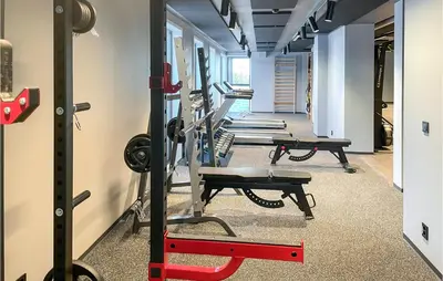 a row of tread machines in a gym at Cozy Apartment In Lillehammer With Wifi in Lillehammer
