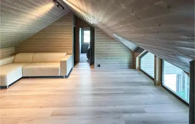 a room with a couch and some windows at Nice Home In Edland With Wifi