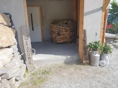 a entrance to a house with a sign in the doorway at Molden 1 - med Jacuzzi! in Luster