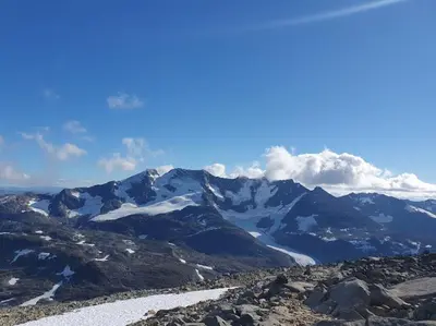 a view of a mountain range with snow at Molden 2-fjellutsikt og jacuzzi tilgang. in Luster