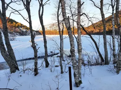 a view of a river in the snow at Holiday Apartment in Flatanger in Vik