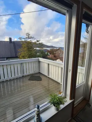 a view from a balcony with a window at Holiday Apartment in Flatanger in Vik