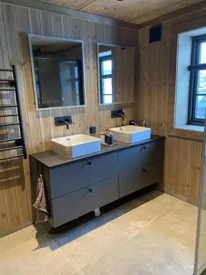 a bathroom with two sinks and two mirrors at New mountain lodge - Geilo-Kikut - Great location in Geilo