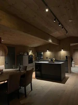 a large kitchen with a table and a counter top at New mountain lodge - Geilo-Kikut - Great location in Geilo
