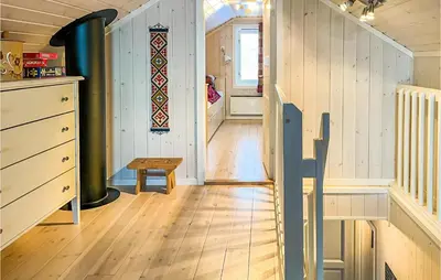 a hallway of a house with a wooden floor and stairs at Beautiful Home In Noresund With Wifi in Noresund