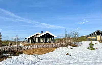 a house in the snow with a fence at Nice Home In Veggli With Wifi in Veggli