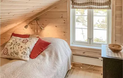 a bedroom with a bed and a window at Nice Home In Veggli With Wifi in Veggli