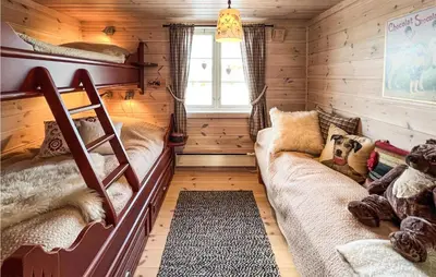 a room with two bunk beds and a couch at Nice Home In Veggli With Wifi in Veggli