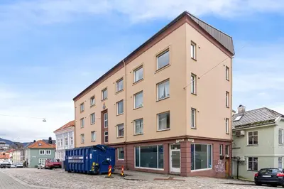 a large building in the middle of a street at Forenom Serviced Apartments Bergen Skottegaten in Bergen