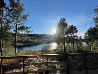 a view of a river from a bridge at A cottage by the forest with a sea view ! in Søfstad