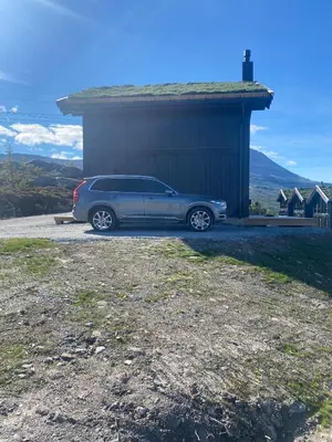 a car parked in front of a building at Gaustablikk Sportshytte midt i naturen in Rjukan