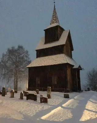 a large wooden church with snow on the roof at Hytte nær Ål in Vass