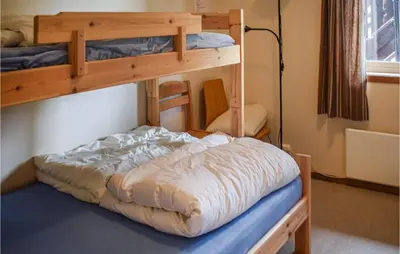 a bedroom with two bunk beds in a room at Hovden Alpin Apartments in Hovden