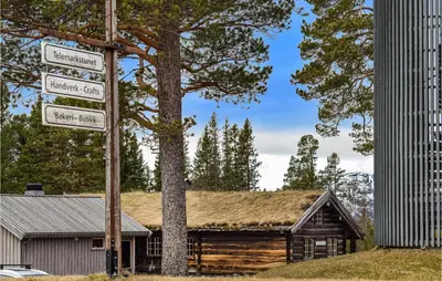 a street sign in front of a log cabin at 2 Bedroom Stunning Home In Rauland in Rauland