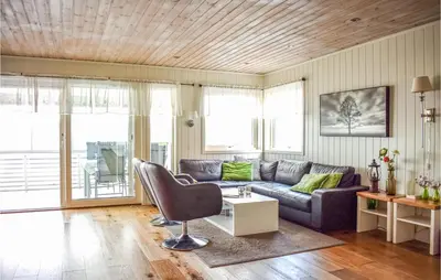 a living room with a couch and a table at 4 Bedroom Lovely Home In Vikebygd in Vikebygd