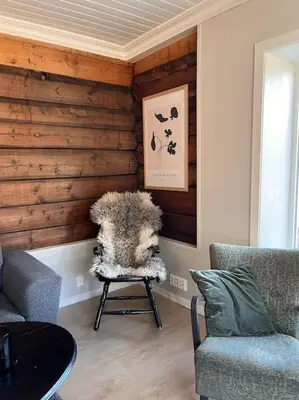 a living room with a table and two chairs at Cozy house in Eidfjord in Eidfjord