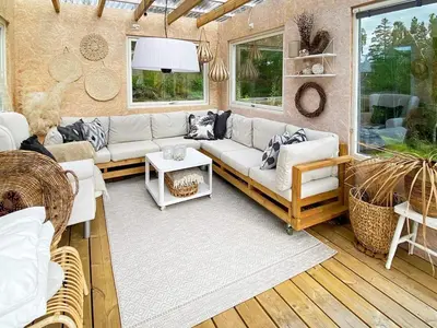 a living room with a couch and a table at 6 person holiday home in Åsenfjord-By Traum in Hopla