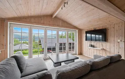a living room with a couch and a table at Cozy Home In Meisingset With Kitchen in Meisingset