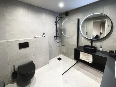 a bathroom with a sink and a mirror at Studio Leilighet, nyoppusset in Langevåg
