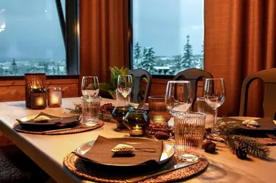 a table with wine glasses and napkins on it at New ap The Nest in Hafjell ski in out and fast Wifi in Øyer