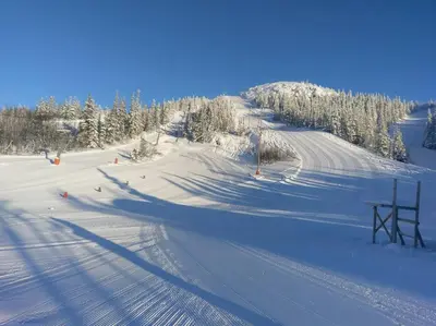 a snow covered ski slope with a ski lift at SKI INN/OUT - 4-room apartment w/3 bedroom in Gaustablikk