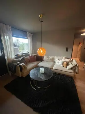 a living room with a couch and a table at SKI INN/OUT - 4-room apartment w/3 bedroom in Gaustablikk