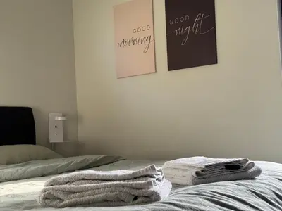 a bedroom with two towels on a bed at Chalet Orkanger - Close to Everything, Far from Ordinary in Orkanger