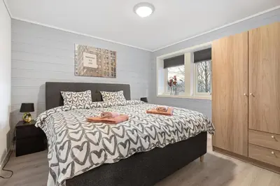 a bedroom with a bed with two towels on it at Apartments Bergen free parking in Bergen