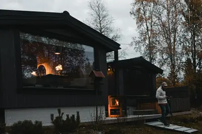 a man standing in front of a tiny house at Ådalsvollen Retreat in Verdal