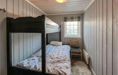 a bedroom with a bunk bed in a room at Amazing Home In Sjusjøen With Sauna in Sjusjøen