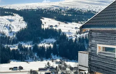 a view of a snow covered mountain from a house at Stunning Home In Ålen in Ålen