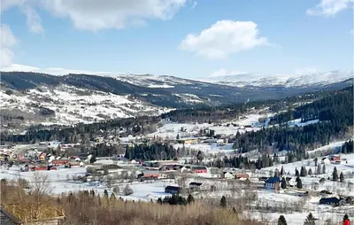 a small town in the snow on a mountain at Stunning Home In Ålen in Ålen