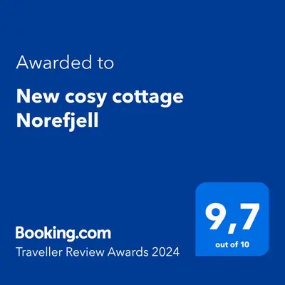 a blue text box with the words upgraded to new cozy cottage norfolk at Norebu - Norefjell in Noresund