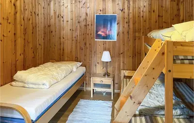 a bedroom with two bunk beds and a lamp at Gorgeous Apartment In Espedalen in Espedalen