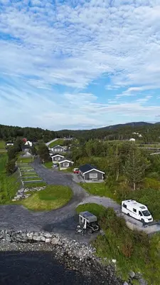 an aerial view of a campsite with a camper and a van at Nothaugen AS in Nordheim