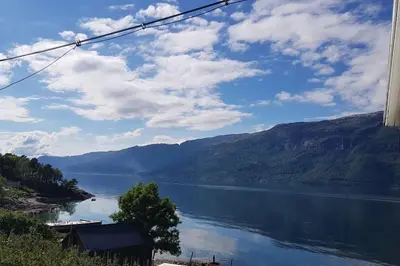 a view of a lake with mountains in the background at Spacious house by the Hardangerfjord in Hesthamar
